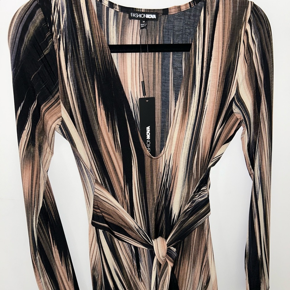 Brand New - Snitches the waist creating a beautiful shape.